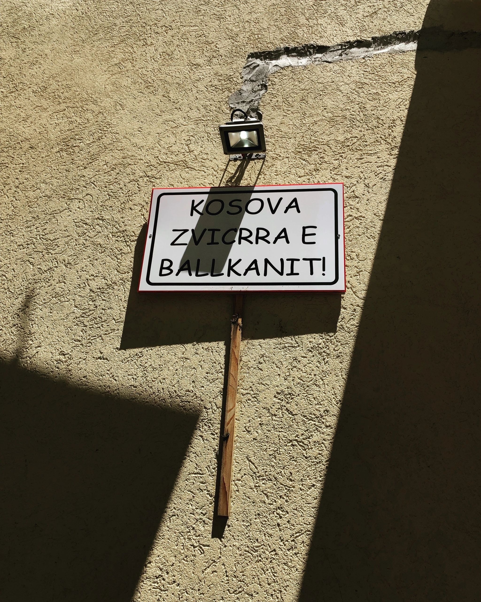 Political protest sign on a Balkan wall