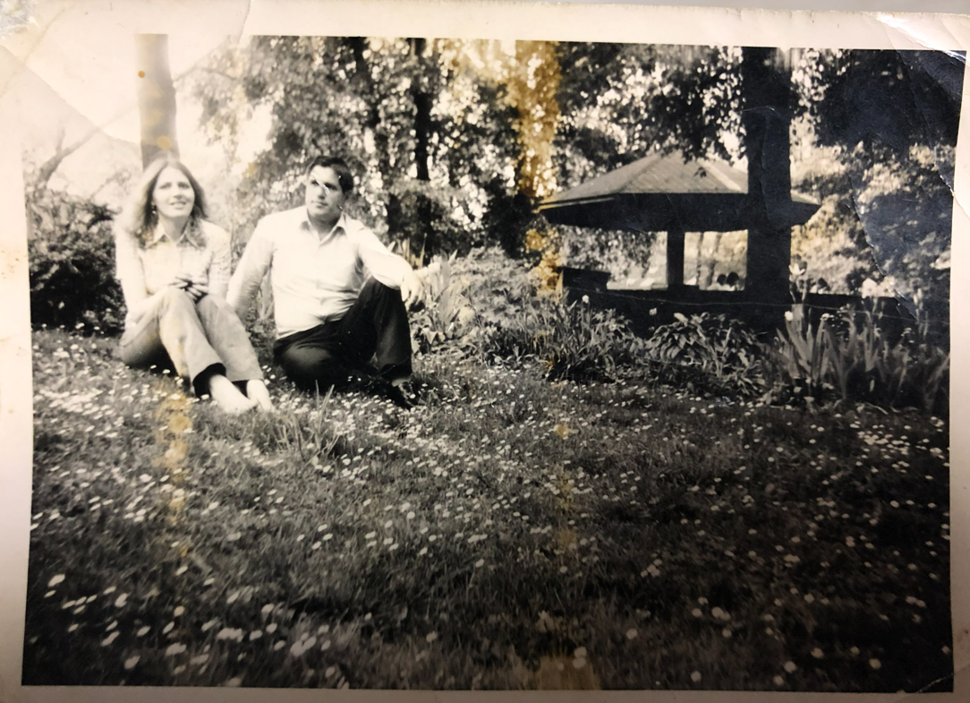 Couple sitting in a garden in a vintage photograph